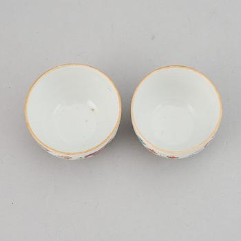 A pair fo famille rose "boys" cups, Qing dynasty late 19th Century.