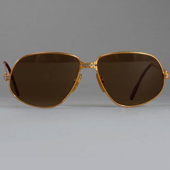 SOLGLASÖGON, Cartier.