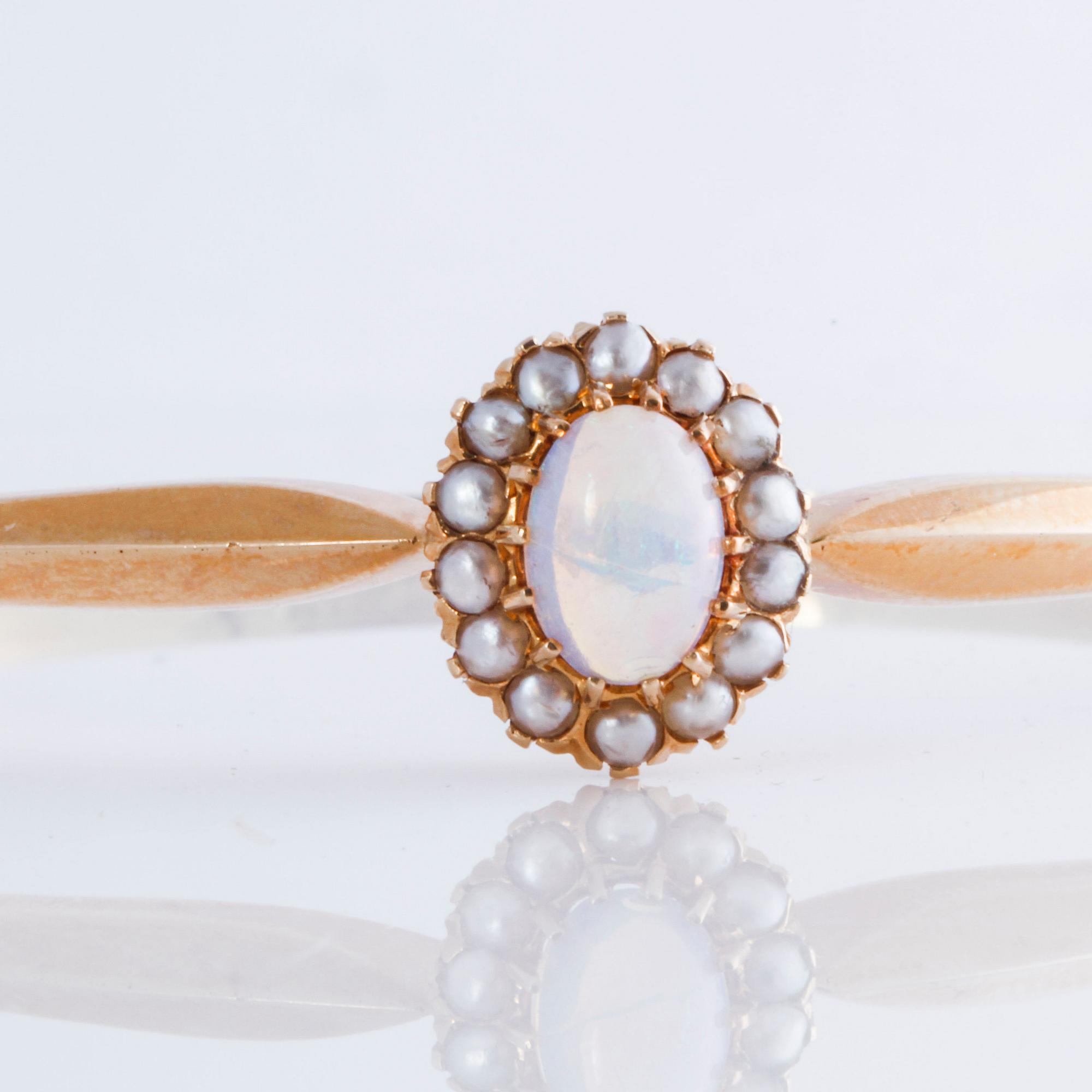 ARMRING, med opal och orientaliska pärlor, Gustav Dahlgren & Co, Malmö, 1917.