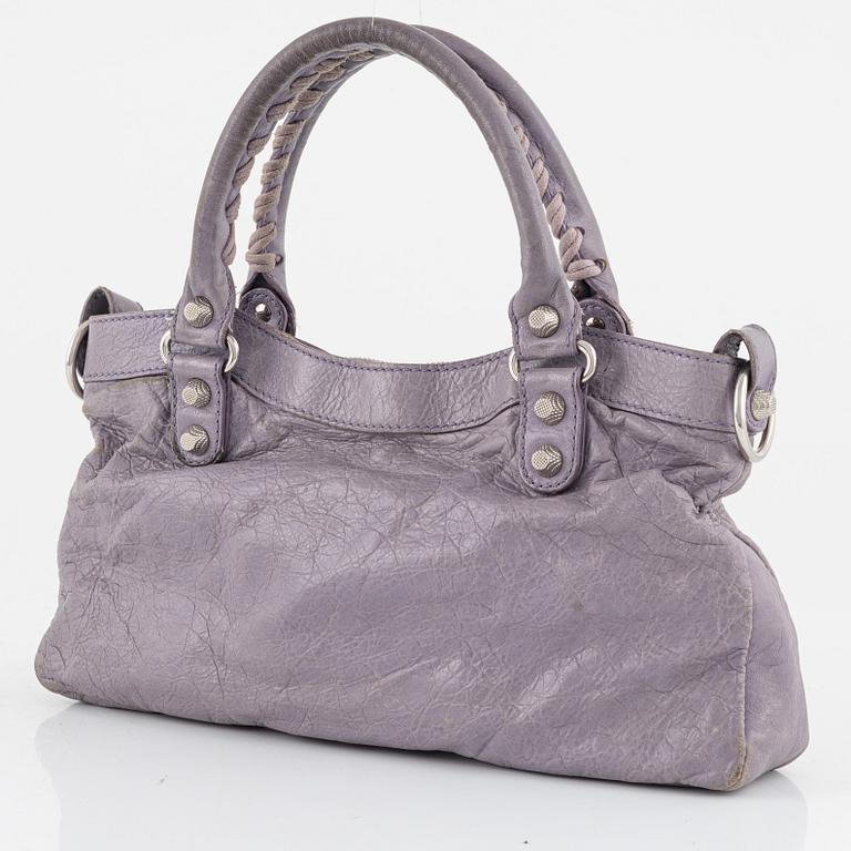 Balenciaga, a purple leather 'City' handbag.