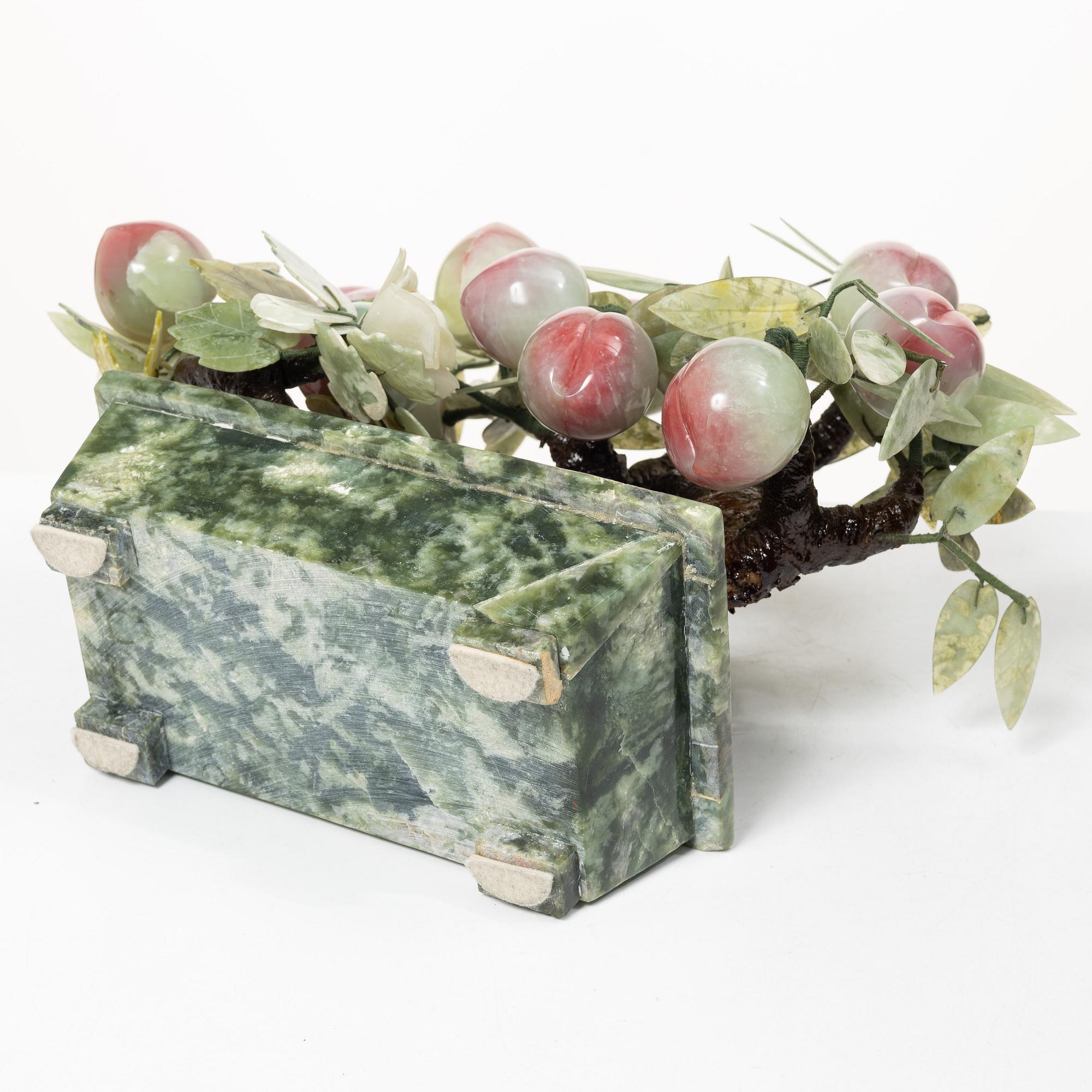 A stone table decoration in the shape of a peach tree, China, 20th century.
