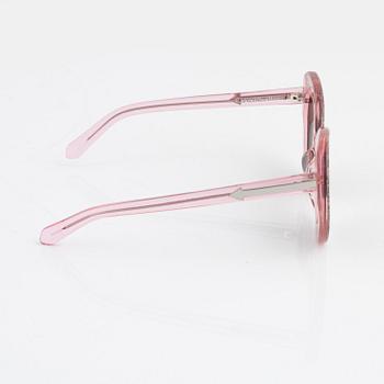 Karen Walker, a pair of pink "Intergalactic" sunglasses.