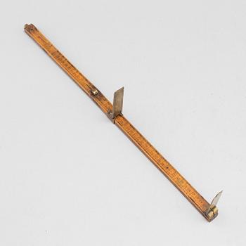 A 19th century wooden measuring stick.