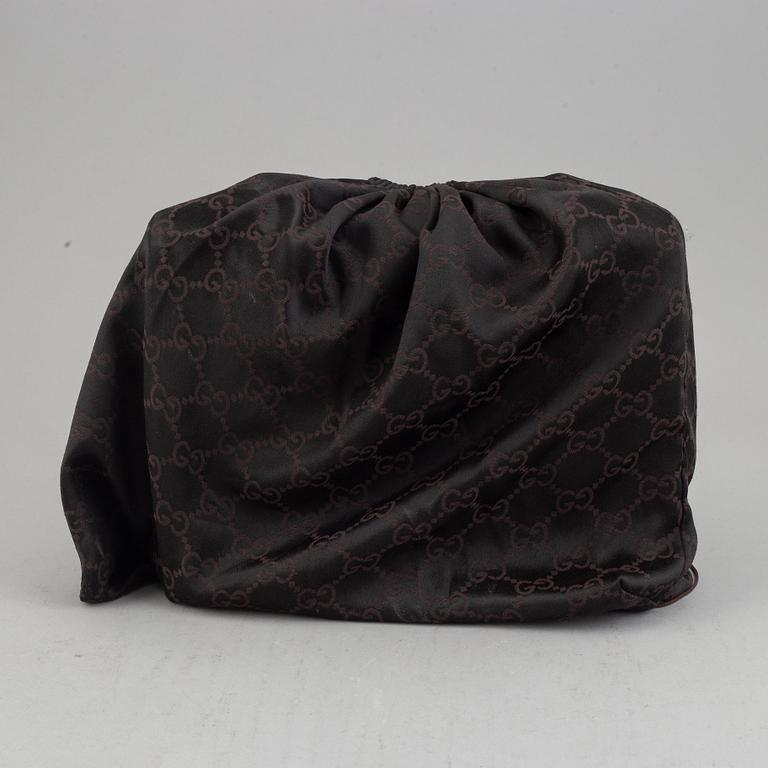 Gucci, a leather and bamboo bag.