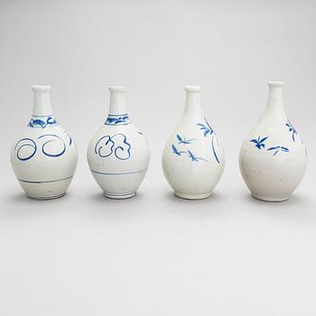 Seven ceramic sake bottles, Japan, the first half of the 20th century.