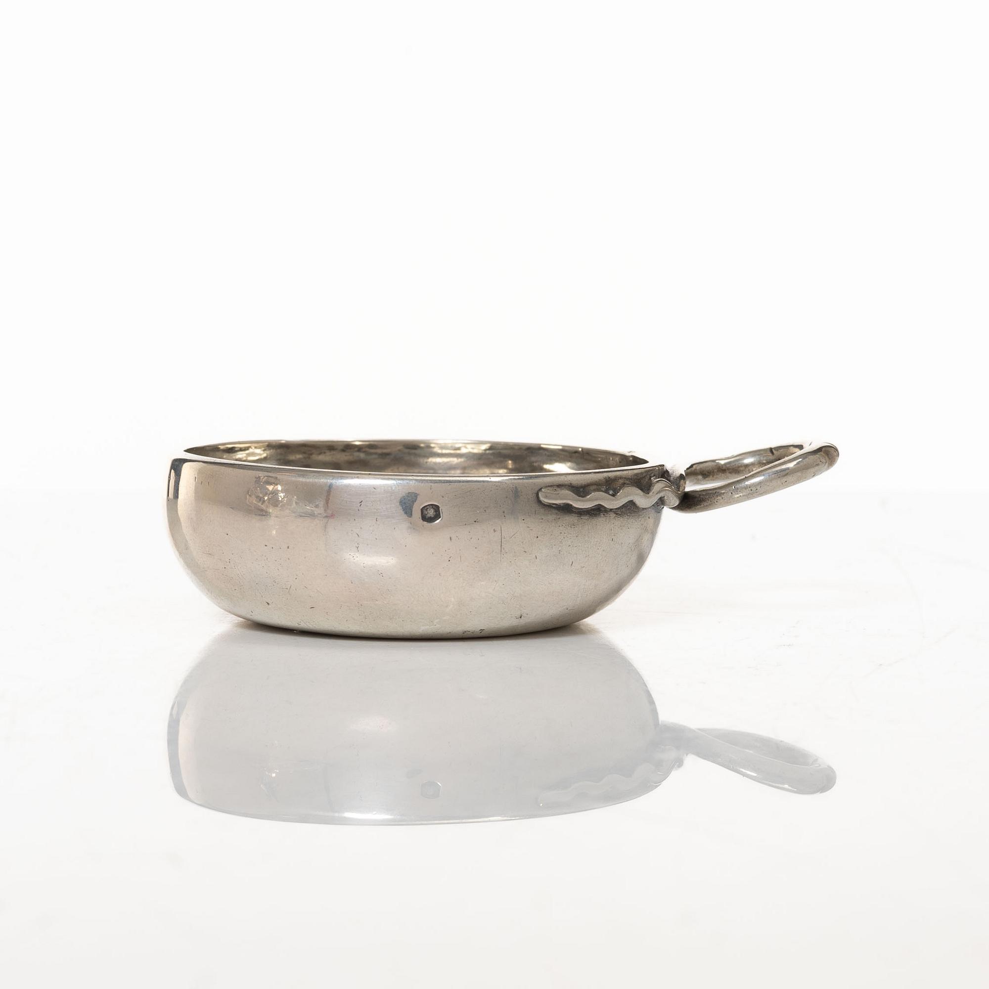 A French silver tastevin, mid-19th Century.