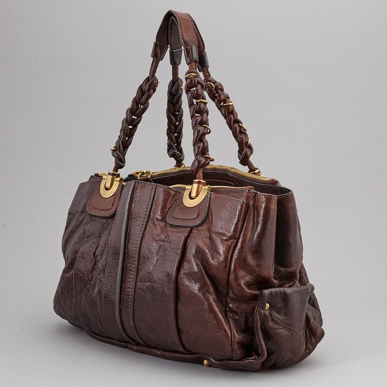 CHLOÉ, a brown leather bag.