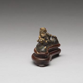 A bronze brush rest, Ming dynasty (1368-1644).