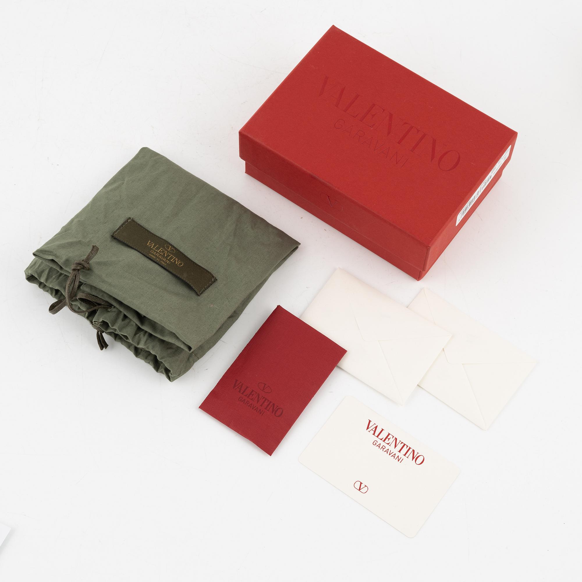 Valentino Garavani, a leather and studs wallet.