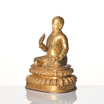 A gilt copper alloy figure of a Lama, most likely Sonam Tsemo, Tibet, probably 16/17th century.