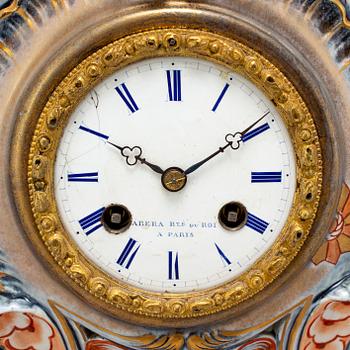 A new rococo creamware bracket clock, after Meissen model, early 20th century.