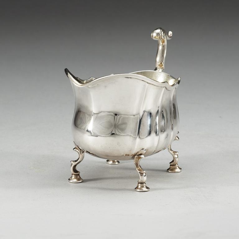 A Swedish 18th century parcel-gilt cream-jug, makers mark of Lars Castman, Vimmerby 1760.
