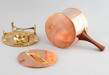 A copper pot with rechaud by Jens Quistgaard, third quarter of the 20th century.