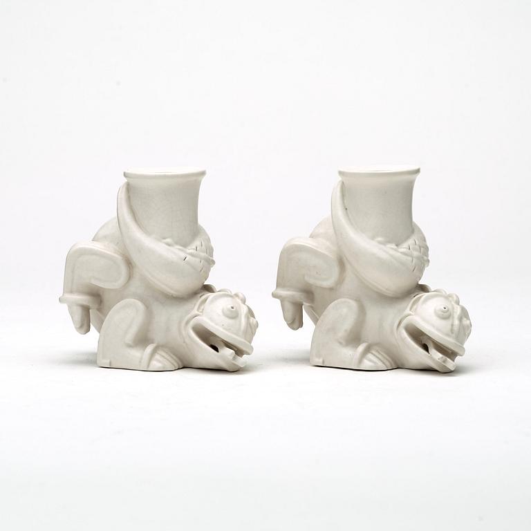 Wilhelm Kåge, a set of stoneware figures of a 'dragon puppy' and two 'dragon puppies' with candle holders, Gustavsberg, ca 1940.