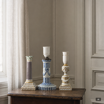 Royal Copenhagen, Two table lamps and a candlestick, Denmark, late 19th–early 20th century.