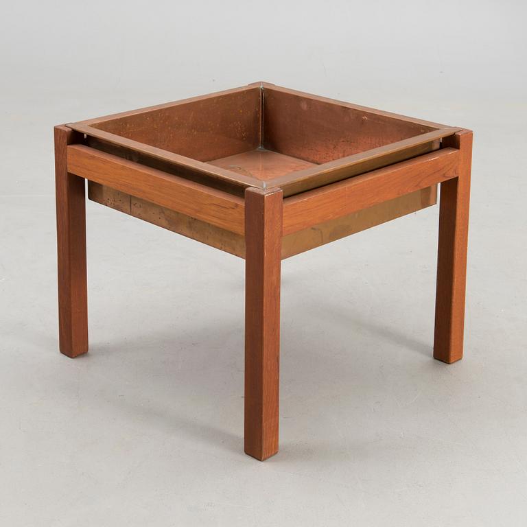 A mid-20th century flower table for Puunveisto Oy - Träsnideri Ab, Finland.