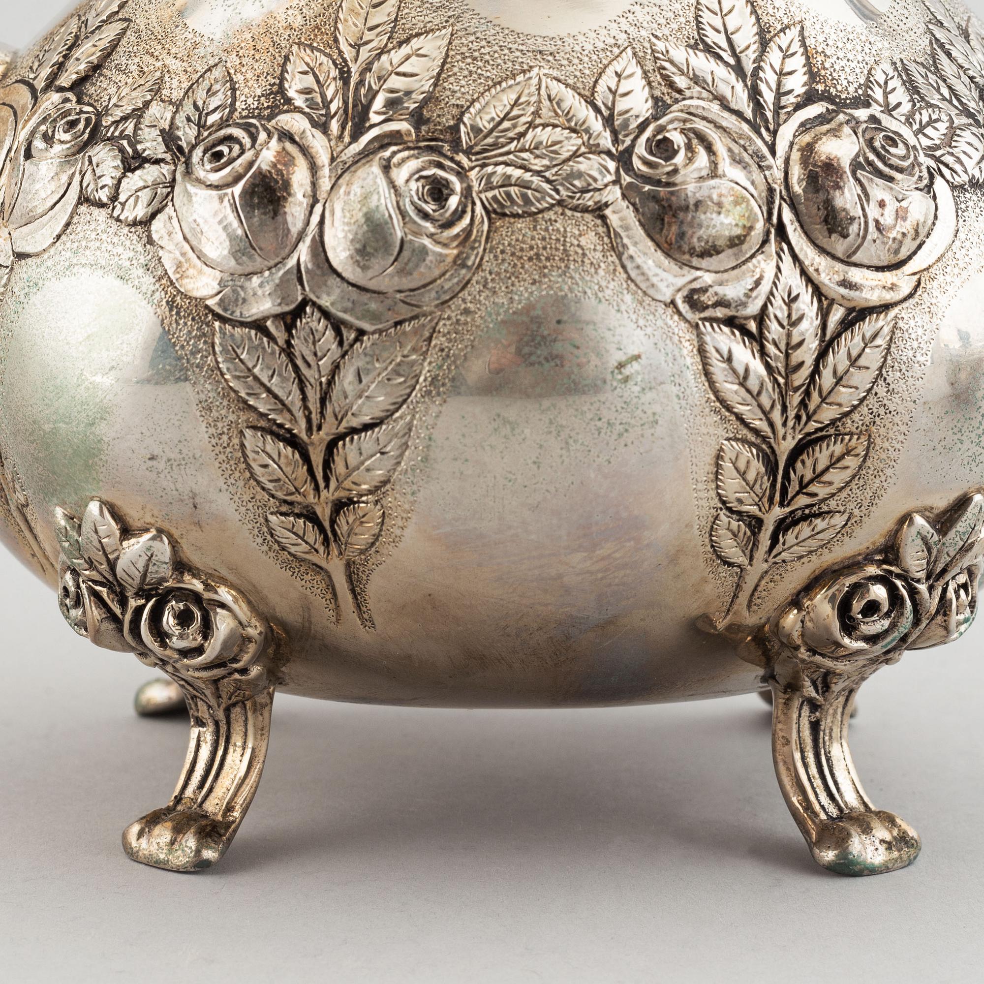 A rococo-style coffee pot, creamer and sugar bowl, swedish import mark, 20th century.