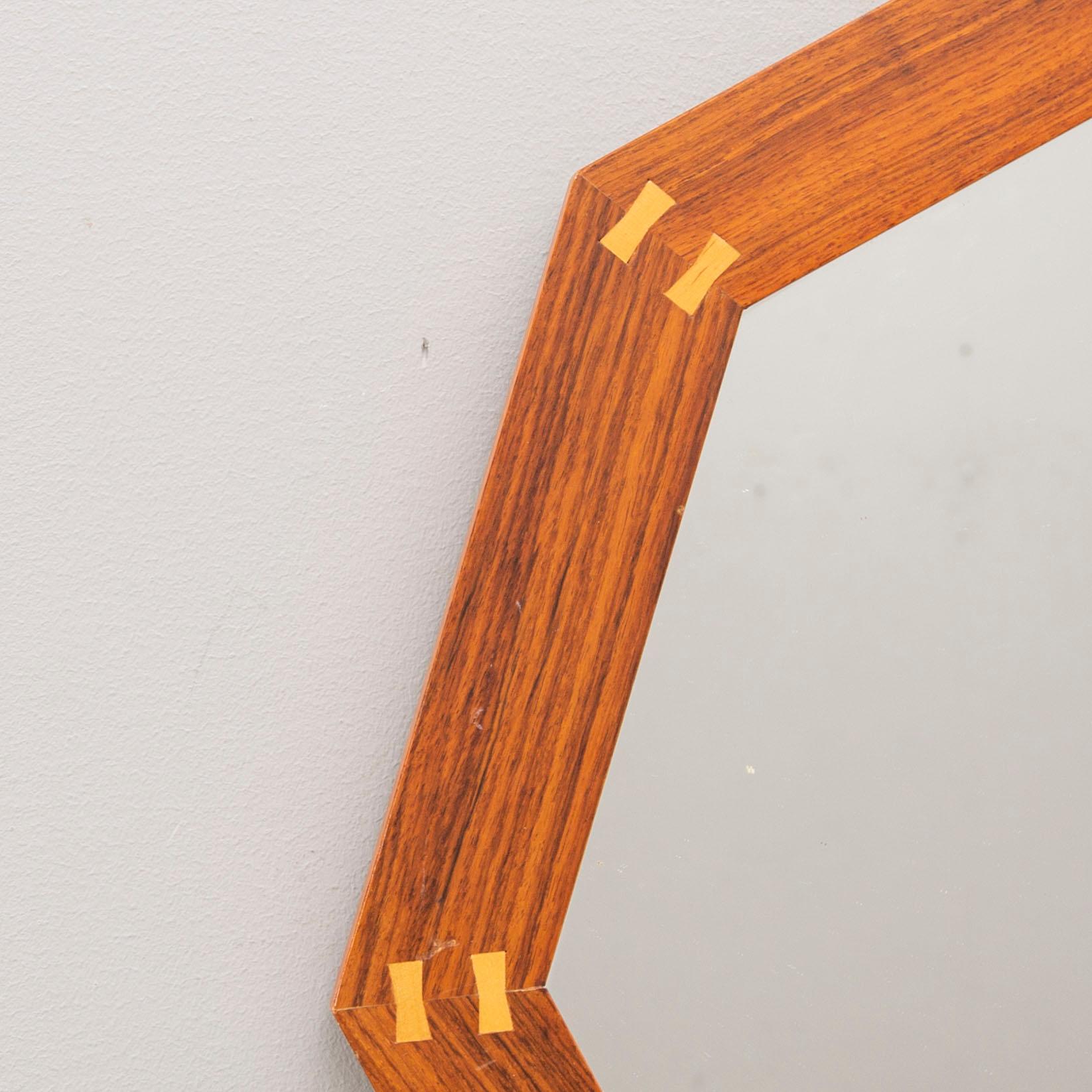 A Sigvard Bernadotte jacaranda mirror for Aktuell Form later part of the 20th century.