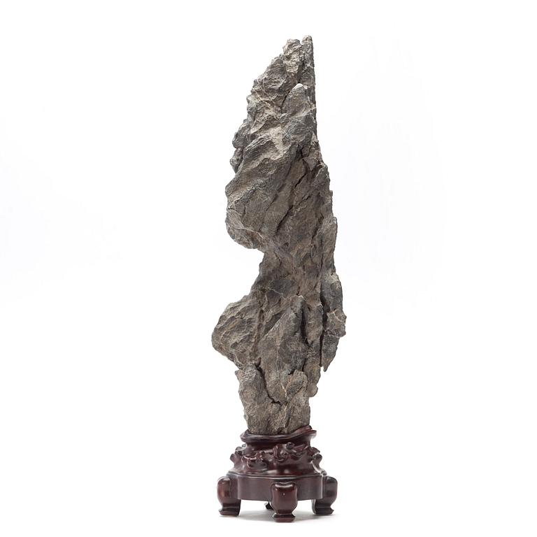 A Chinese scholars rock with a wooden stand, 20th Century.