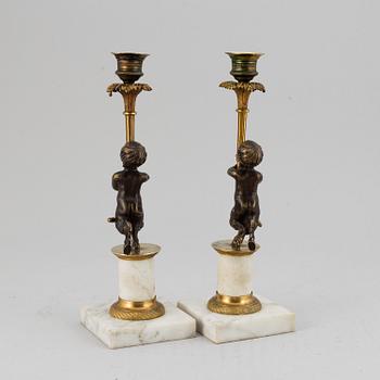 A pair of gustavian style candles sticks, circa 1900.
