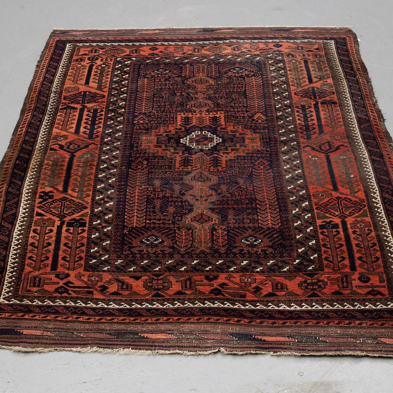 A RUG, semi-antique Baluch, ca 190,5 x 132,5 cm  (+ the ends have 10-11,5 cm flat weave on each side).