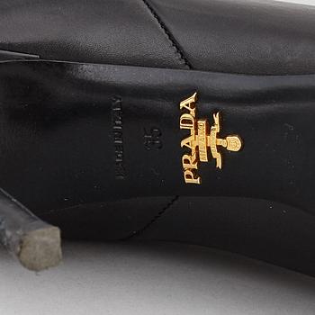 PRADA, a pair of black leather boots, size 35.