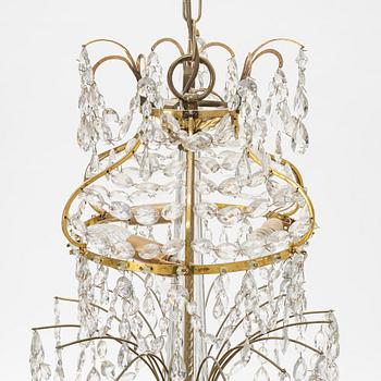 A Gustavian style chandelier with older parts, late 18th and 20th century.