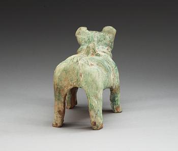 A green glazed figure of a Tibethan dog, Han dynasty (206 BC-220 AD).