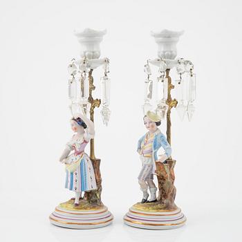 A pair of porcelain Rococo style candlesticks, late 19th Century.