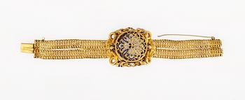 695. WRIST WATCH, 18k gold and enamel.