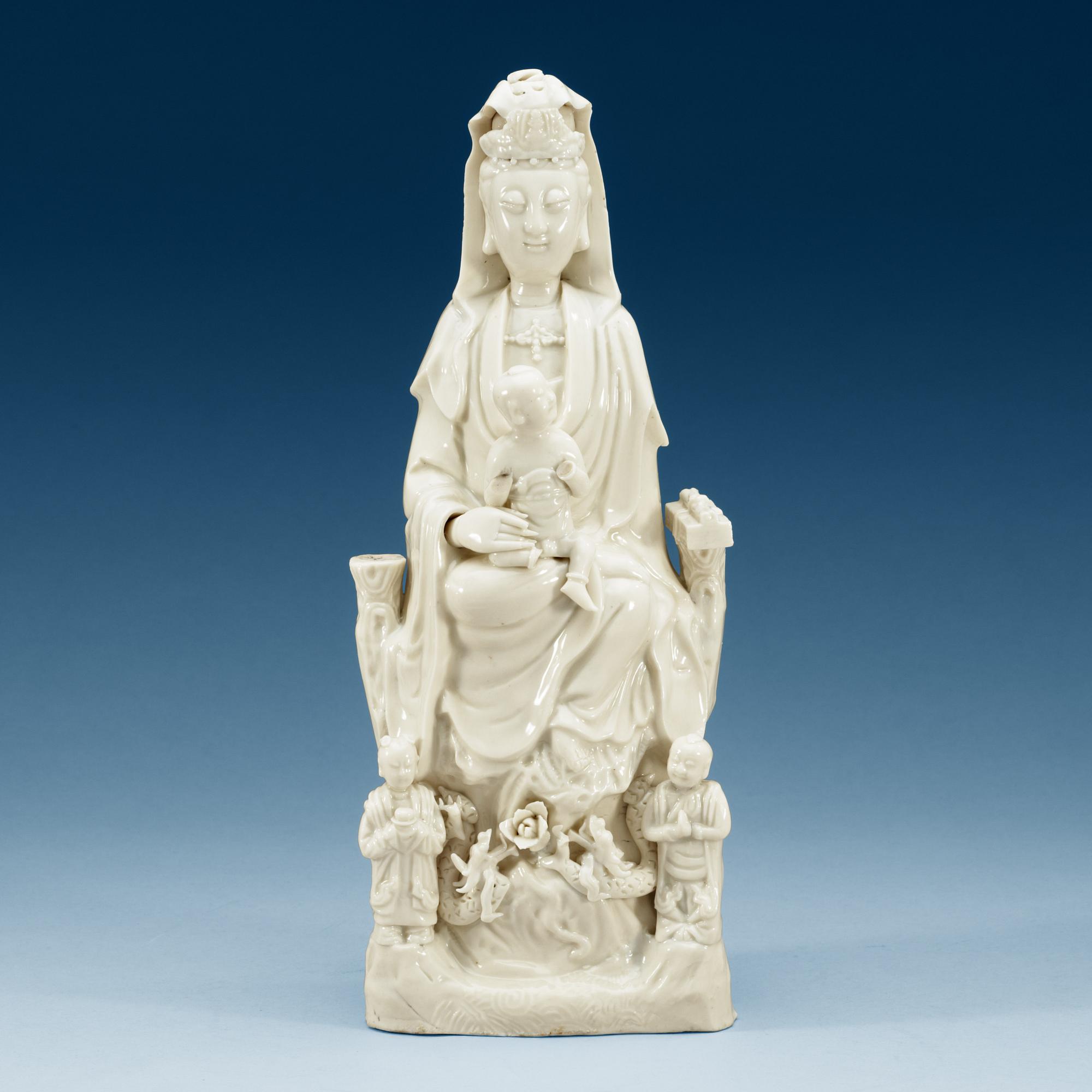 A blanc de chine figure of a seated Guanyin, Qing dynasty, 18th Century.