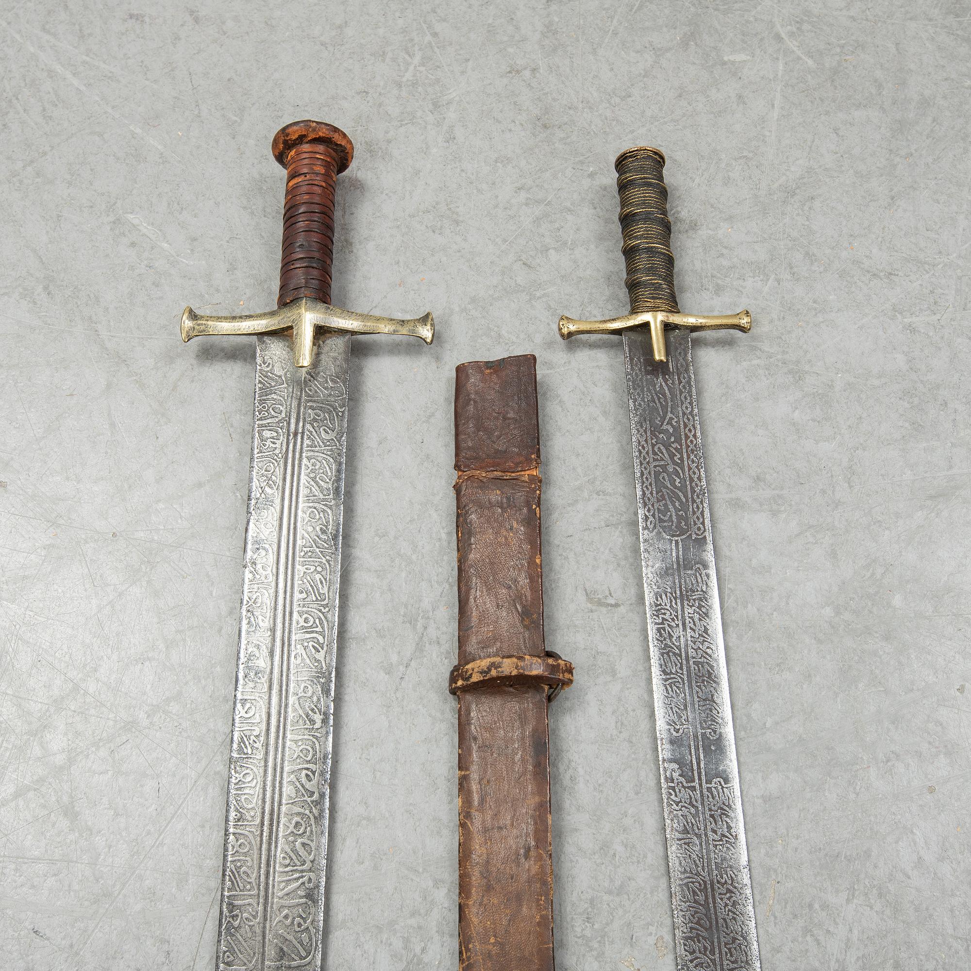 Two East African Kaskara swords- One with scabbard. 19-20th Century.
