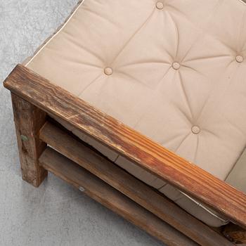 A stained pine garden sofa by Elsa Stackelberg.