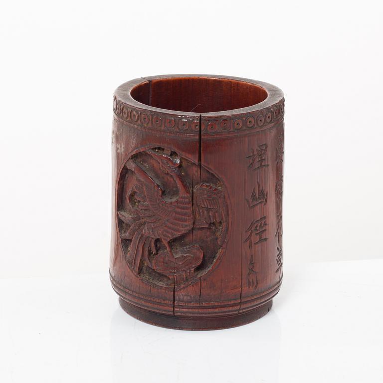 A Chinese bronze vase, joss stick holder and a bamboo brush pot, Qing dynasty.