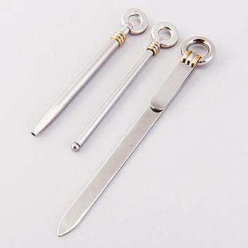 A PEN, CHAMPAGNE BEATER and BOOK MARK, must de Cartier.