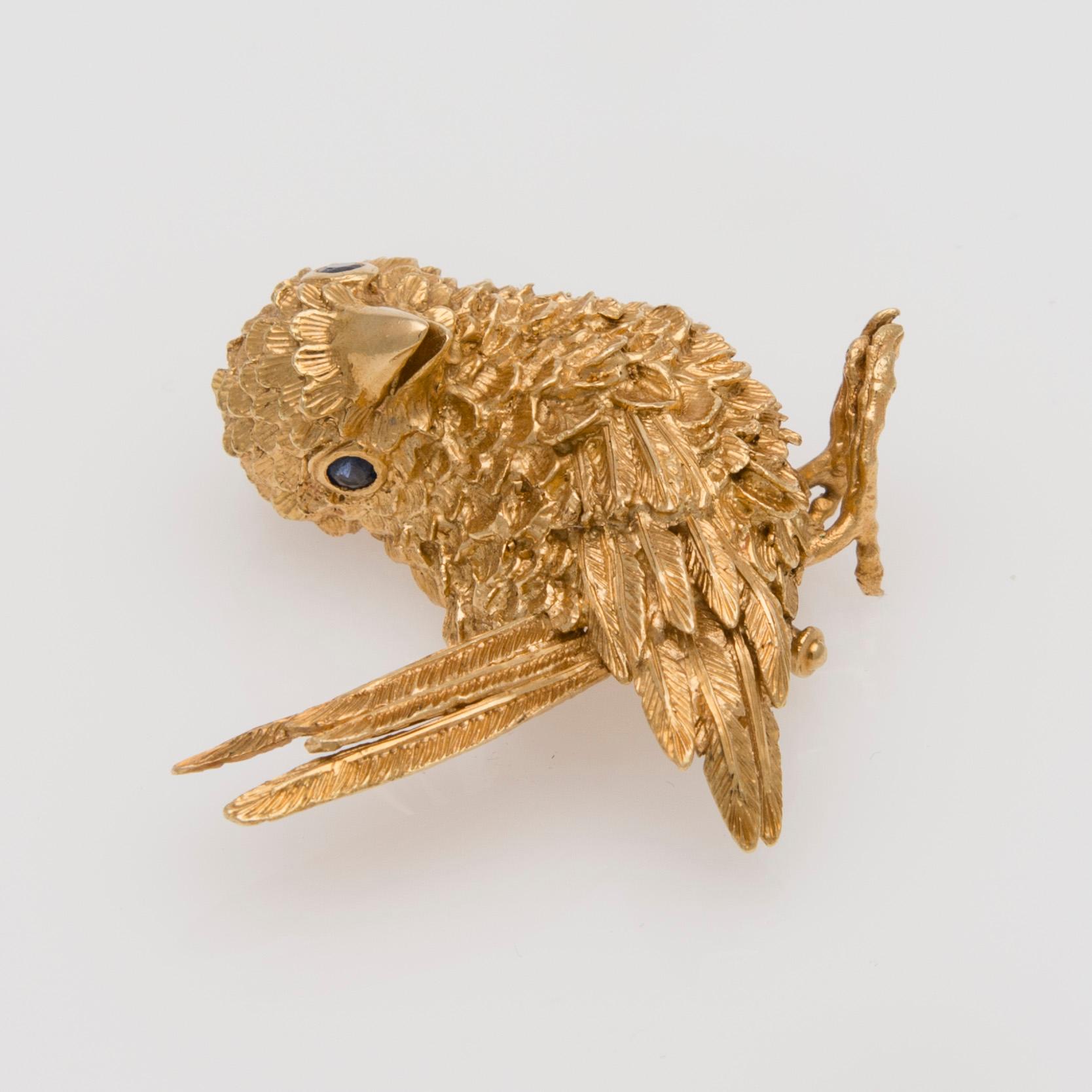 BROSCH, 18K guld, fasettslipade safirer.