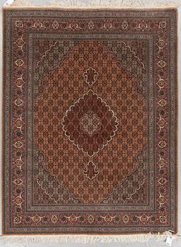 A RUG, Old Tabriz, part silk, ca 201 x 152 cm.