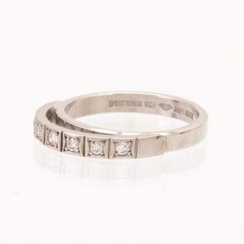 An 18K white gold ring set with round single cut dimamonds.