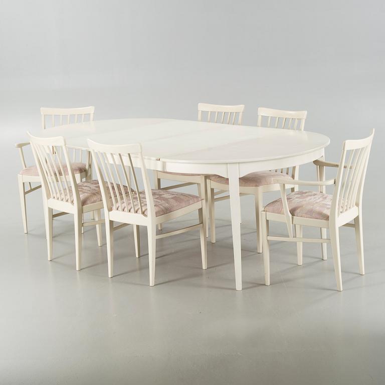 A dining table and six chairs, chairs by Carl Malmsten, model "Herrgården", second half of the 20th century.