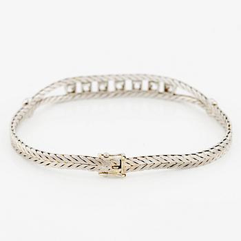 Bracelet in 18K white gold with round brilliant and eight-cut diamonds.