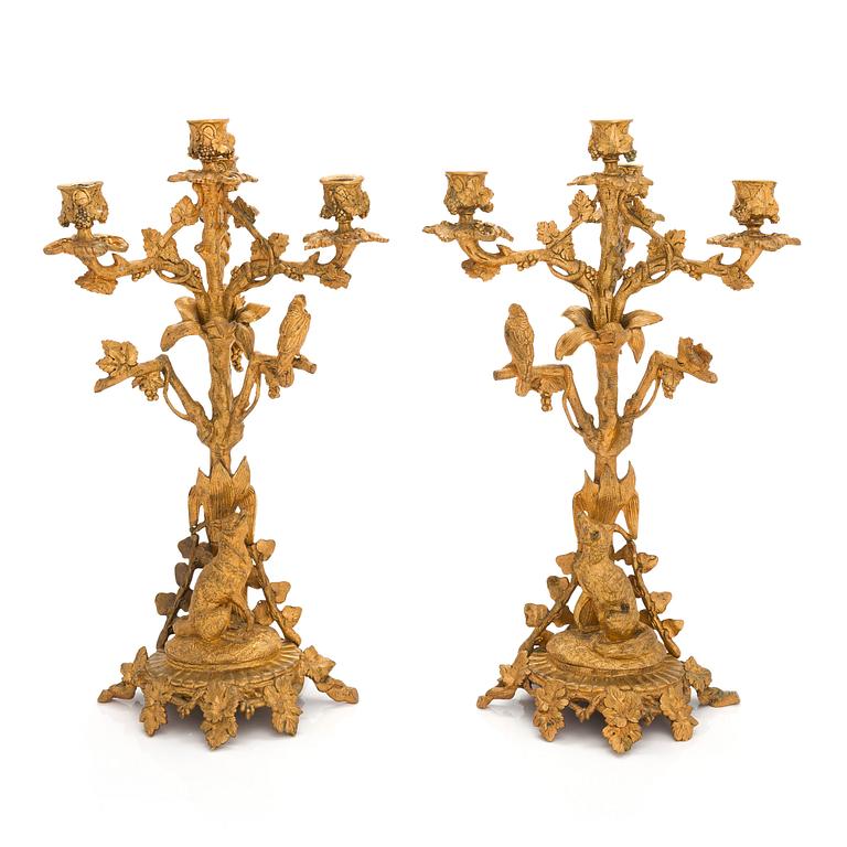 A pair of gilt brass candelabra from the latter half of the 19th century.