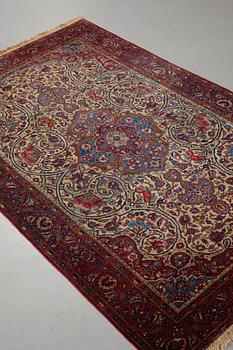 Matto, a semi-antique silk Kashan, ca 212,5-214,5 x 134,5-135,5 cm.