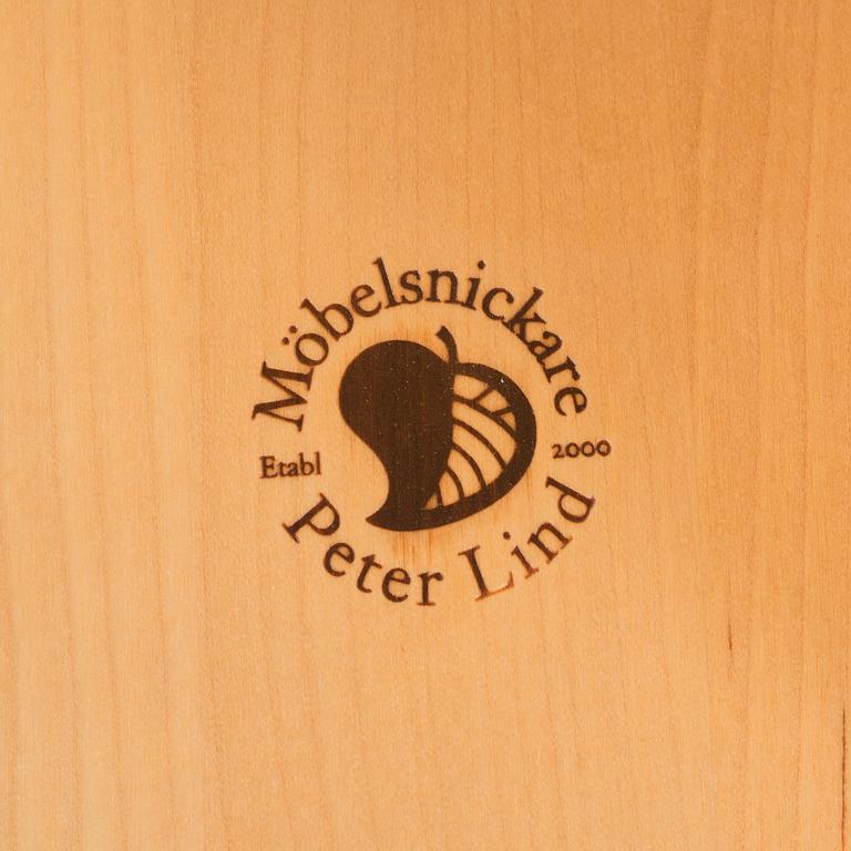 a "plugghästen" chair by Peter Lind.