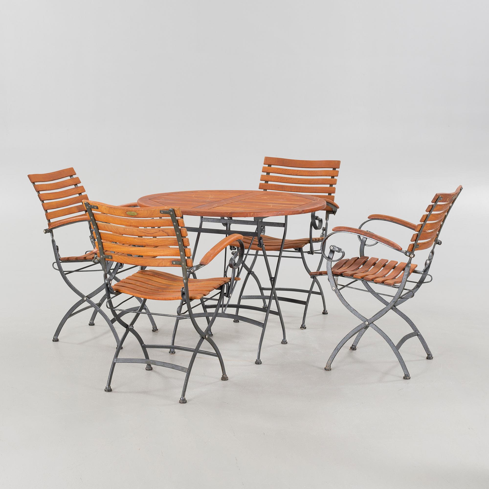 A garden table and four garden chairs from Covent Garden, 21th century.