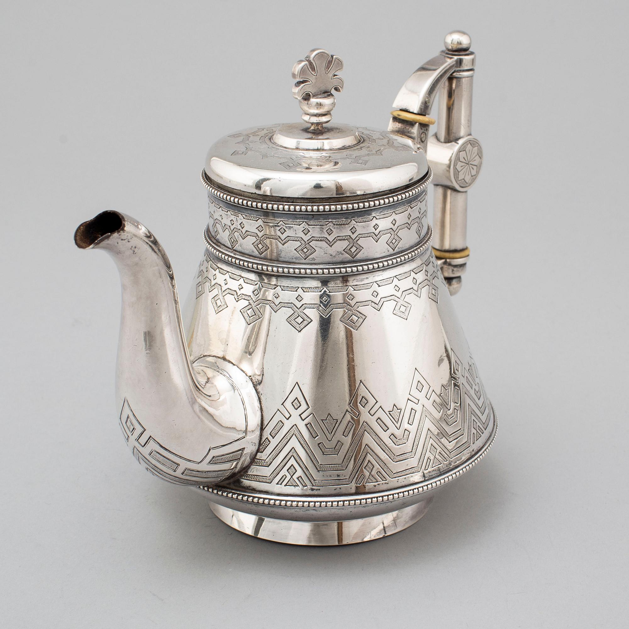 A Russian 19th century parcel-gilt silver tea pot and cream jug, mark possbly of Alexander Lokin, St. Petersburg 1893.