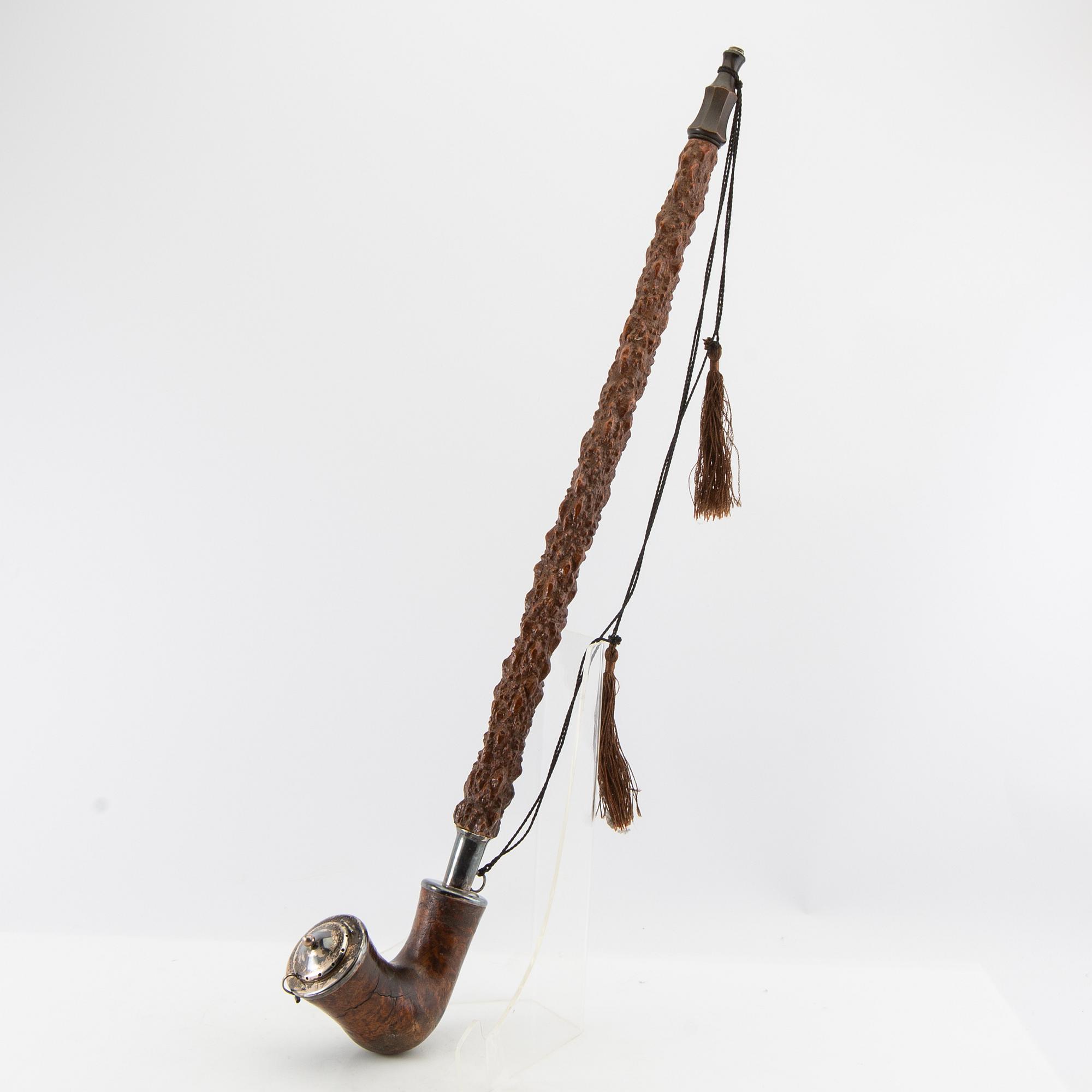 Long pipe  Carved wood with a silver mount Hasa Malmö 1986.