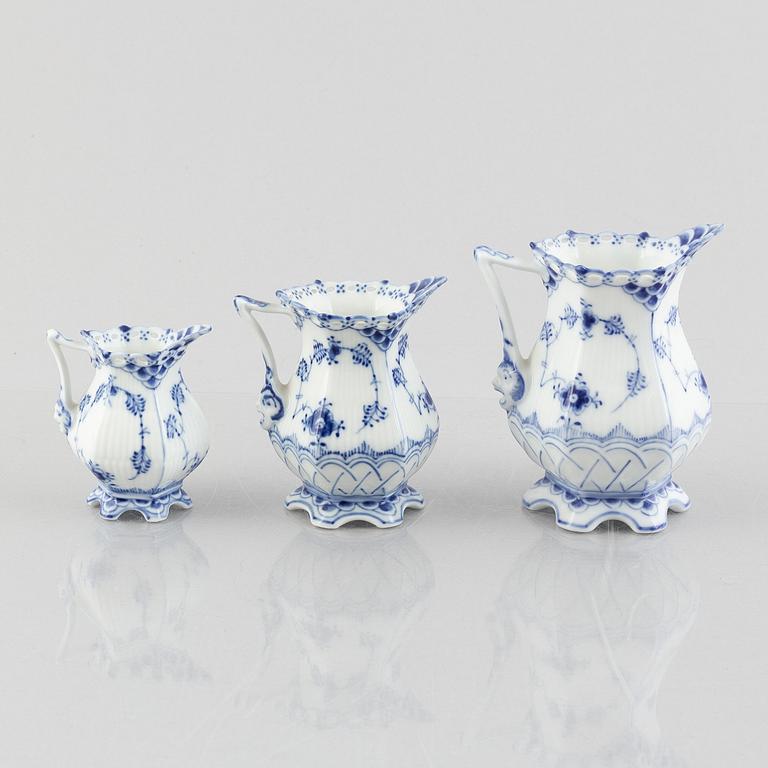 Three 'Blue Fluted Full Lace' / 'Musselmalet' porcelain creamers / jugs, Royal Copenhagen, 20th century.