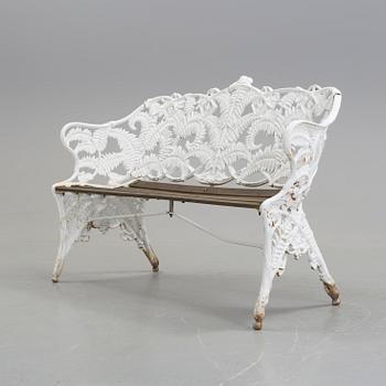 A WHITEPAINTED EARLY 20TH CENTURY SWEDISH AGGENBERG CAST IRON AND WOOD GARDEN SOFA.