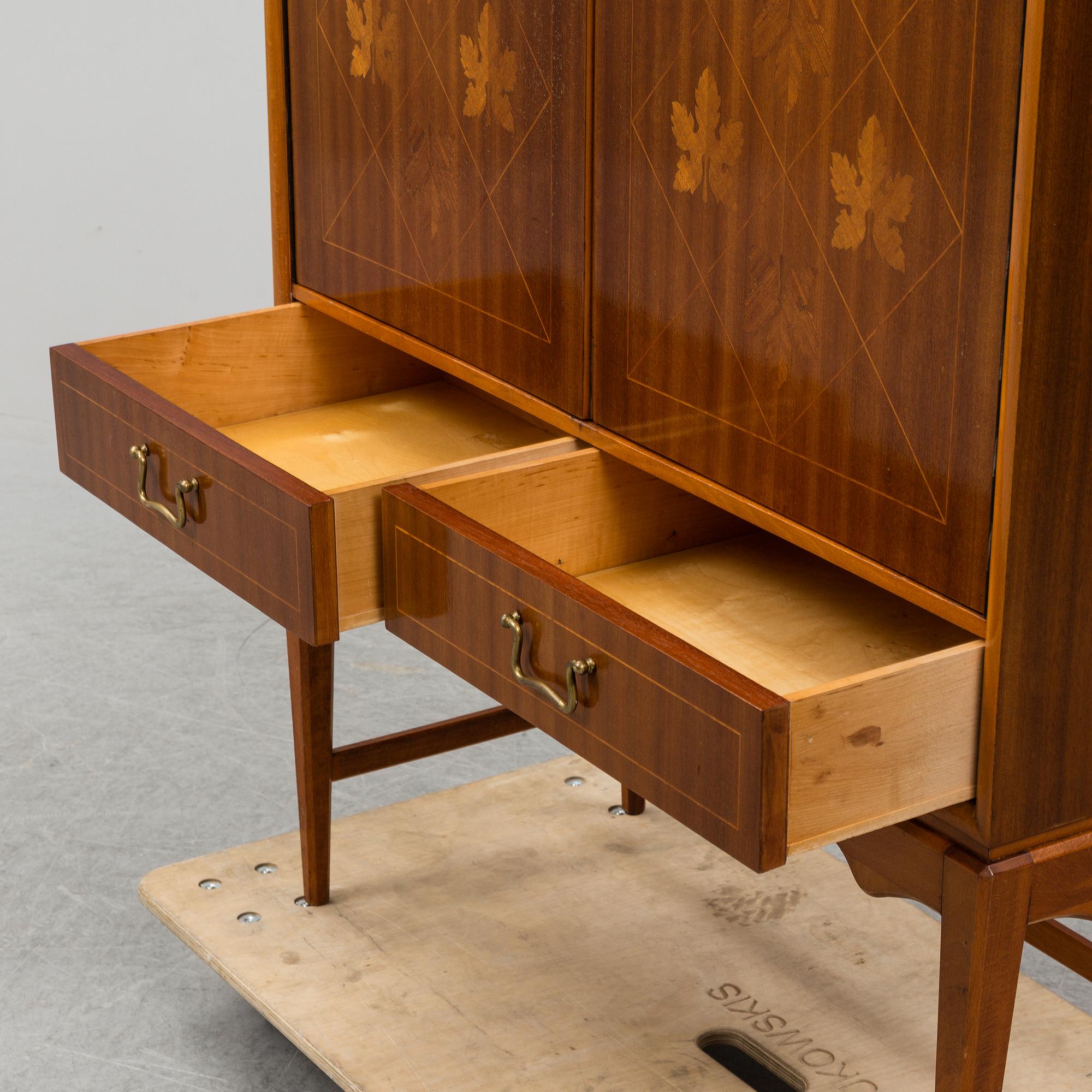 A mid 20th Century bar cabinet.