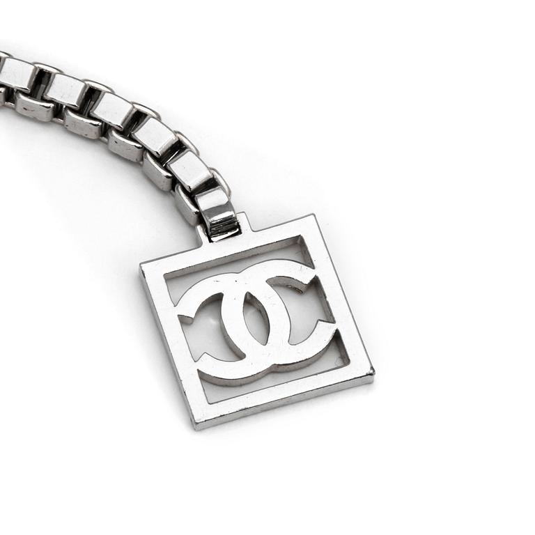 CHANEL, a chain belt.